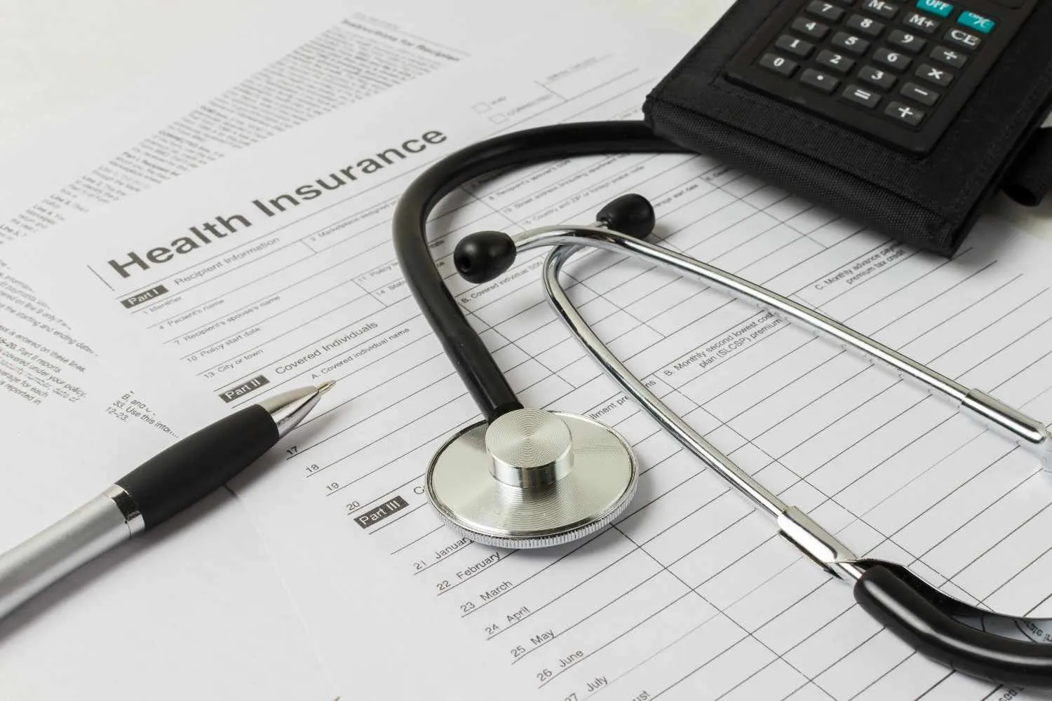 Stethoscope resting on a health cover application